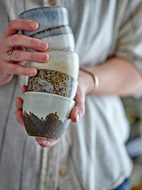 stack of bloom­ingville paula cups showing grey reactive glaze variations
