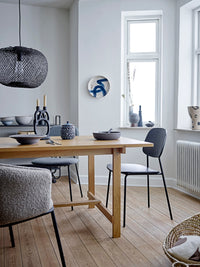 black sculptural two branched bloomingville ramina candle holder styled in nordic dining room
