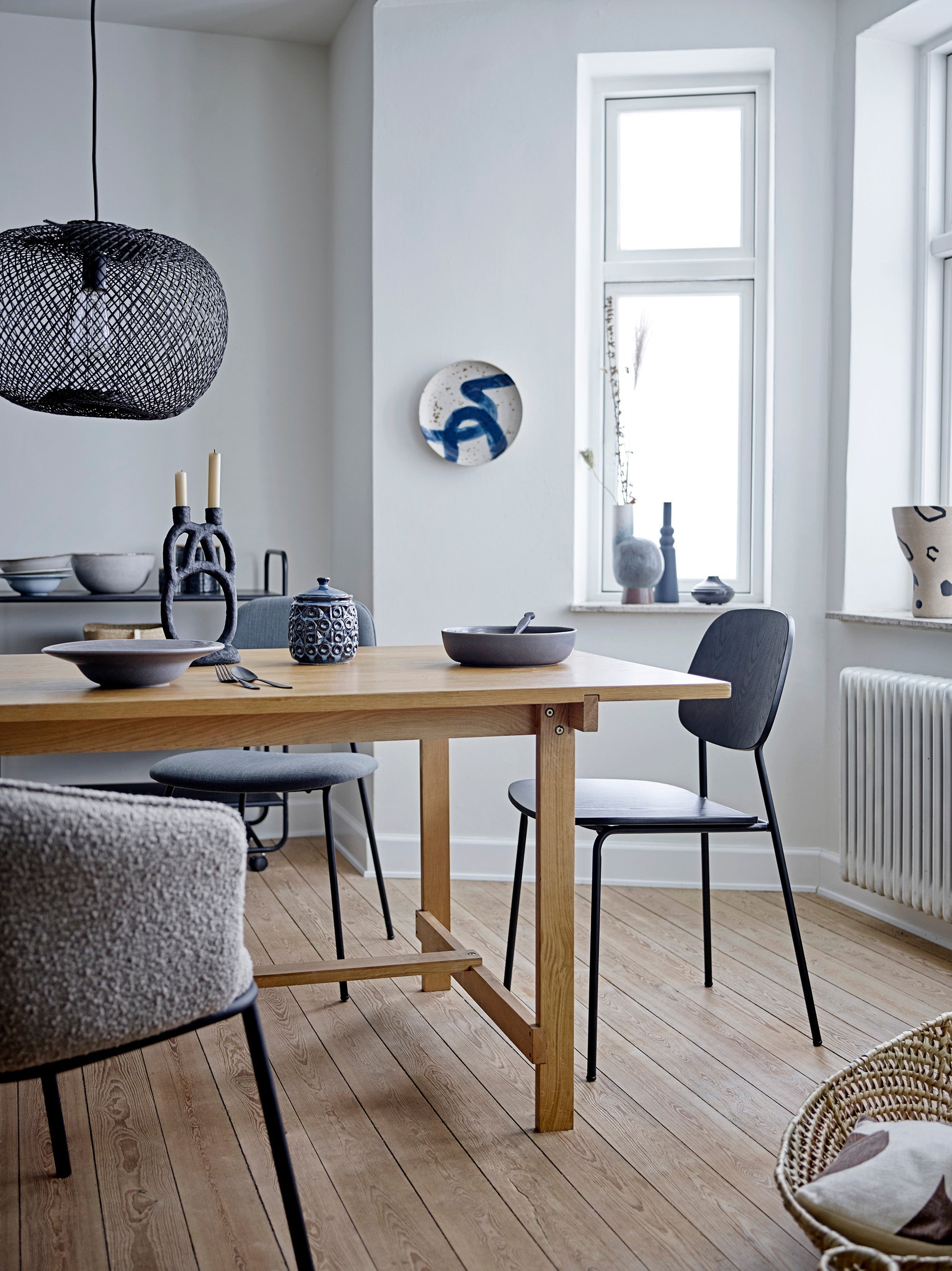 black sculptural two branched bloomingville ramina candle holder styled in nordic dining room
