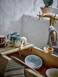 rustic stoneware mugs including the brown bloomingville yori mug styled by an old sink