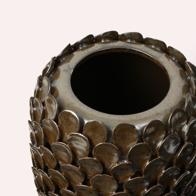 Close-up of the Dorthea Vase rim showing the bronze reactive glaze and overlapping disc texture