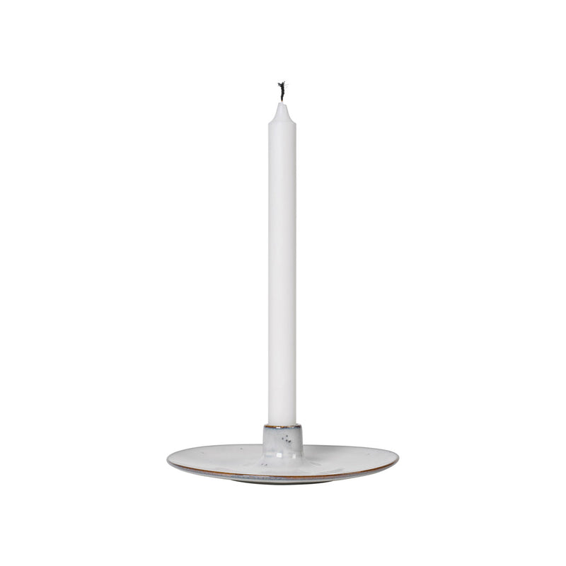 Nordic Sand Candle Holder with a white taper candle standing in the centre