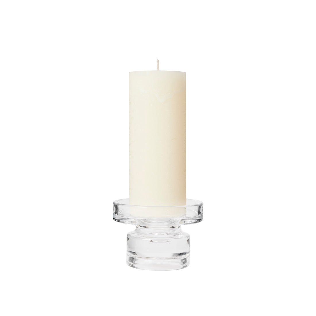 Petra clear glass candle holder with a tall cream pillar candle on top