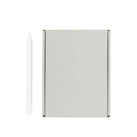 White Rustic Taper Candle shown beside its Broste Copenhagen grey box