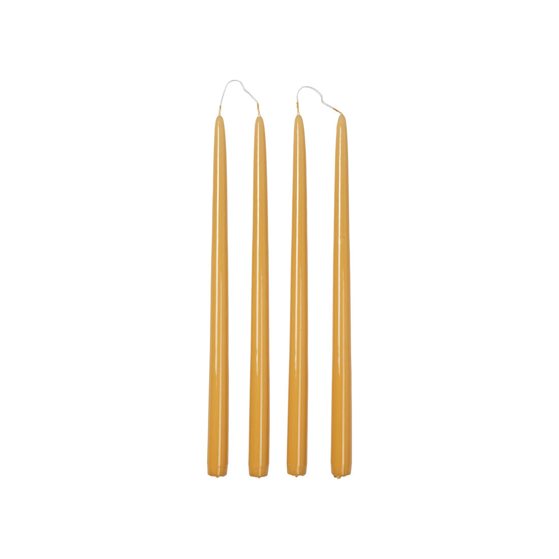 Four Broste Copenhagen Smooth Glossy Taper Candles in Golden Yellow on a white background