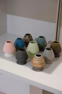 collection of ceramic chasen naoshi matcha whisk stands in multiple colours including eco green
