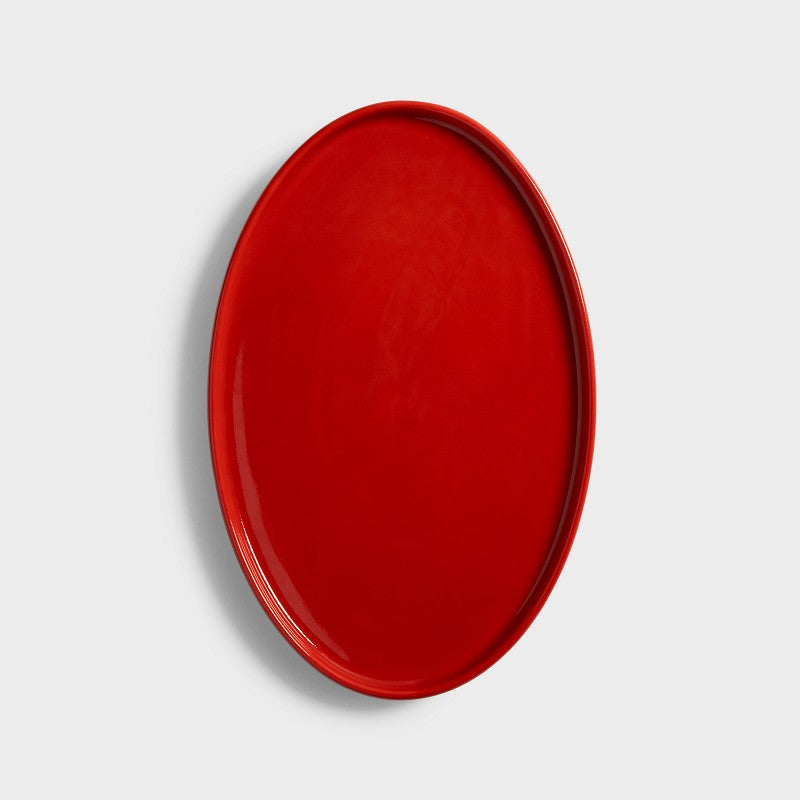 Chiquito oval tray in glossy red porcelain seen from above by &Klevering