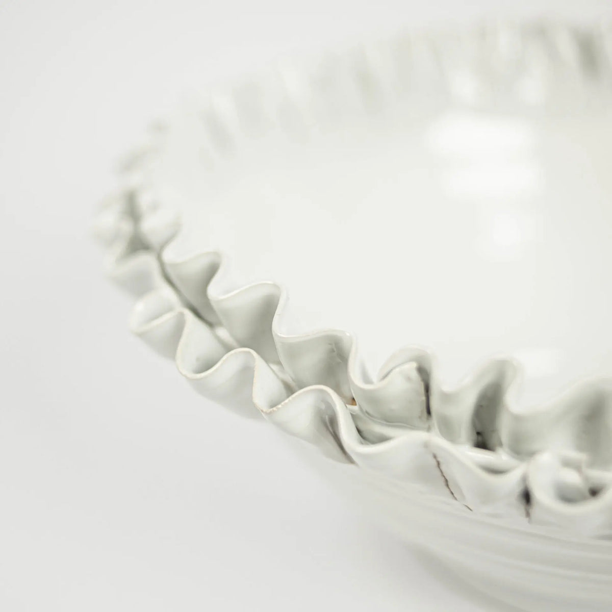 Close-up of the ruffled edge on the Claudine ceramic bowl by Olsson & Jensen