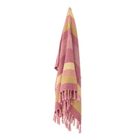 pink and yellow striped throw hanging to show full length and fringed edges