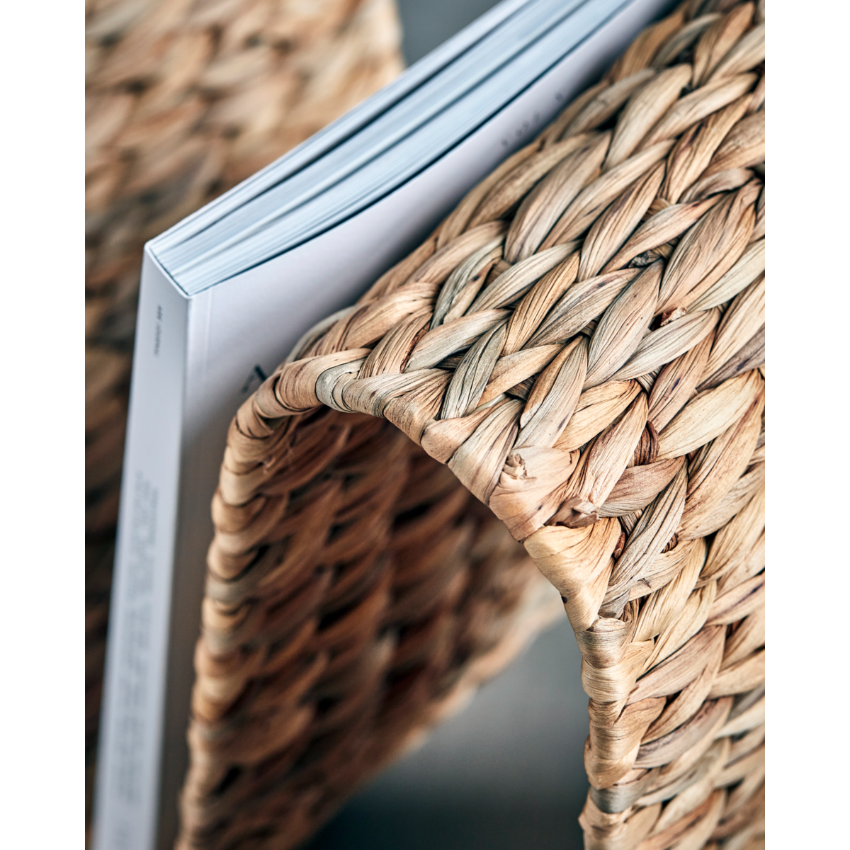 curved water hyacinth magazine holder with iron frame by house doctor
