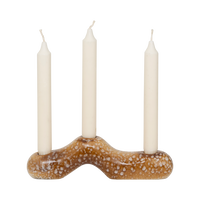 Daru candle holder holding three ivory dinner candles