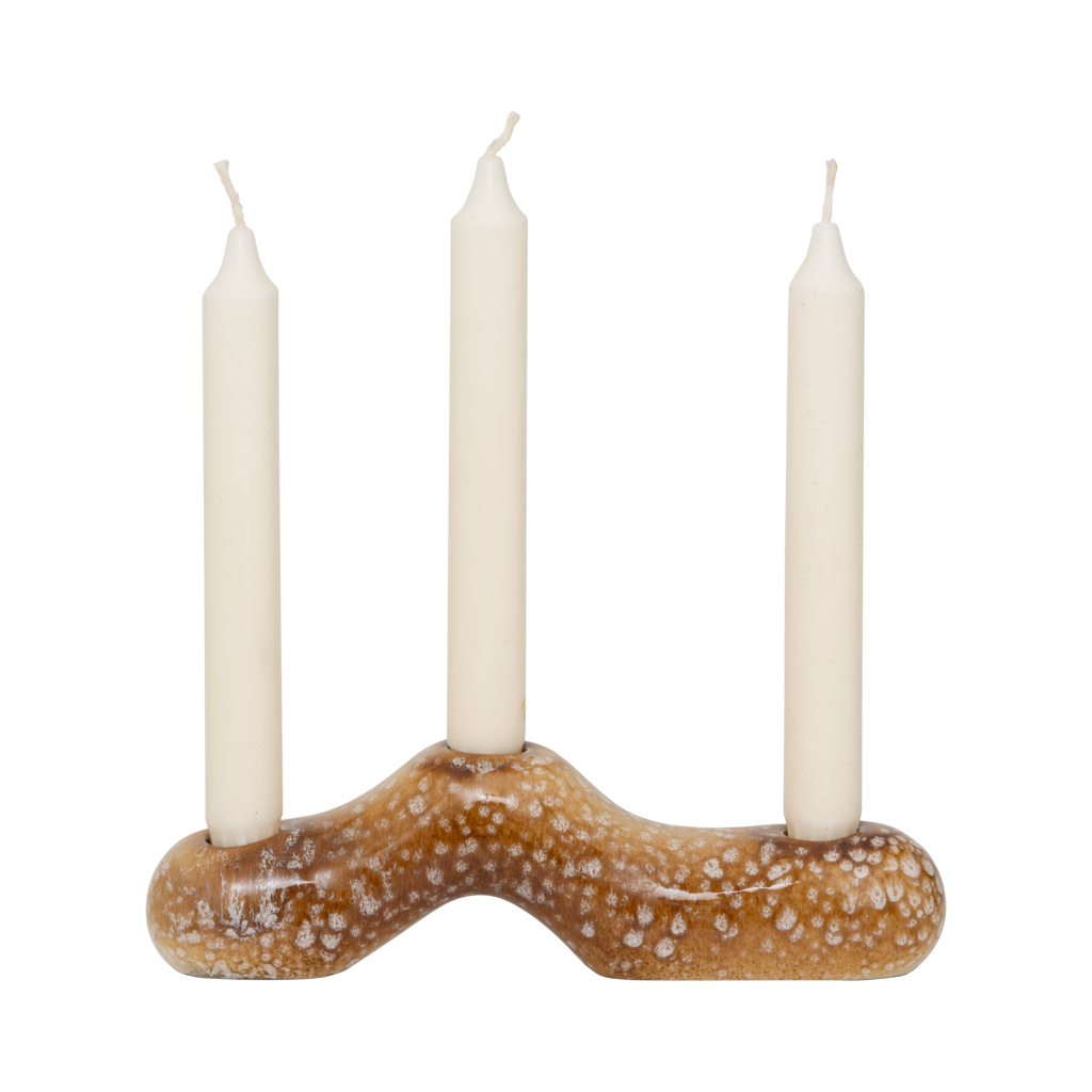 Daru candle holder holding three ivory dinner candles