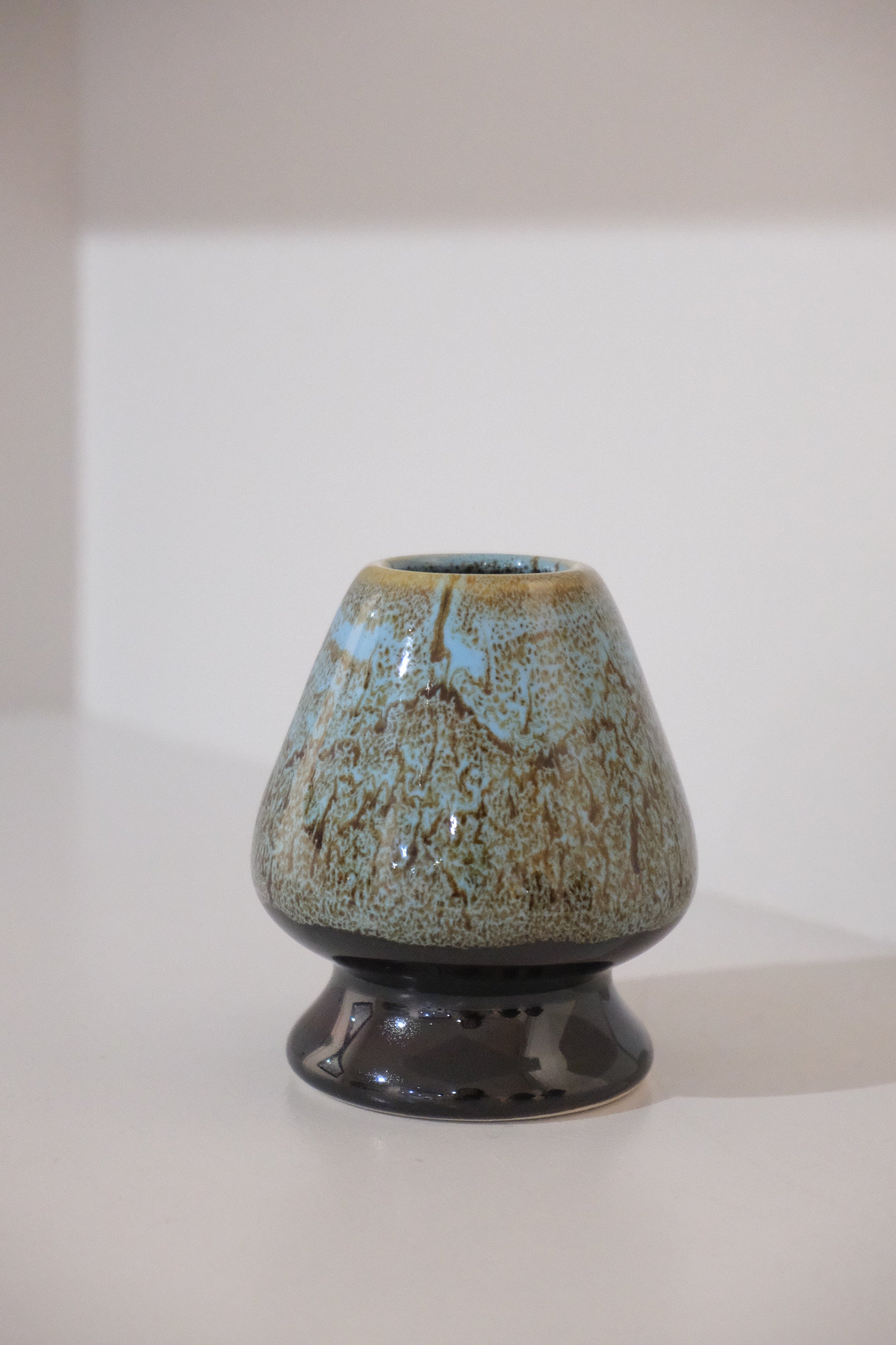 close up of eco blue kusenaoshi matcha whisk holder
