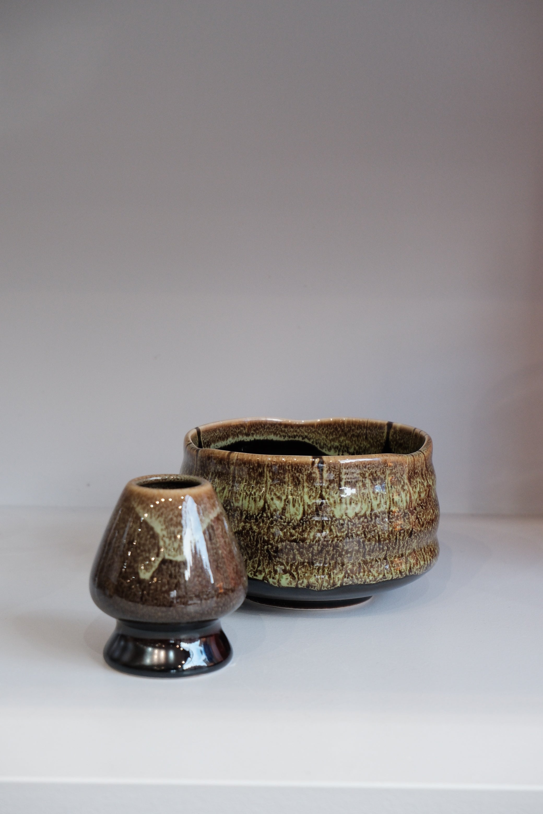 eco green matcha whisk holder with earthy glazed finish
