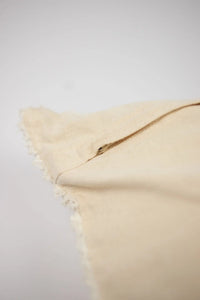 Edge detail of the Elba cream cushion by Olsson & Jensen showing the plain back