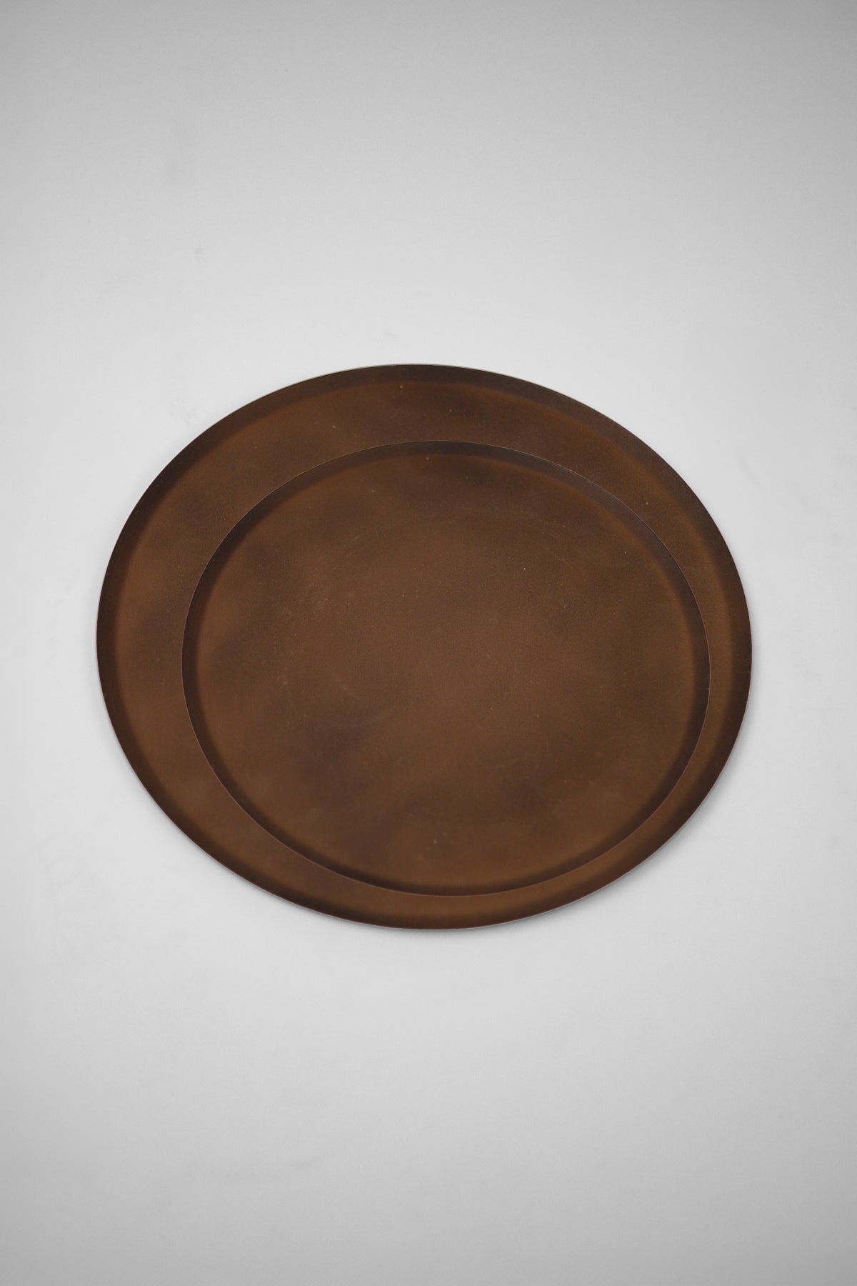 Elia rustic iron candle plates by Olsson & Jensen in 20 cm and 30 cm