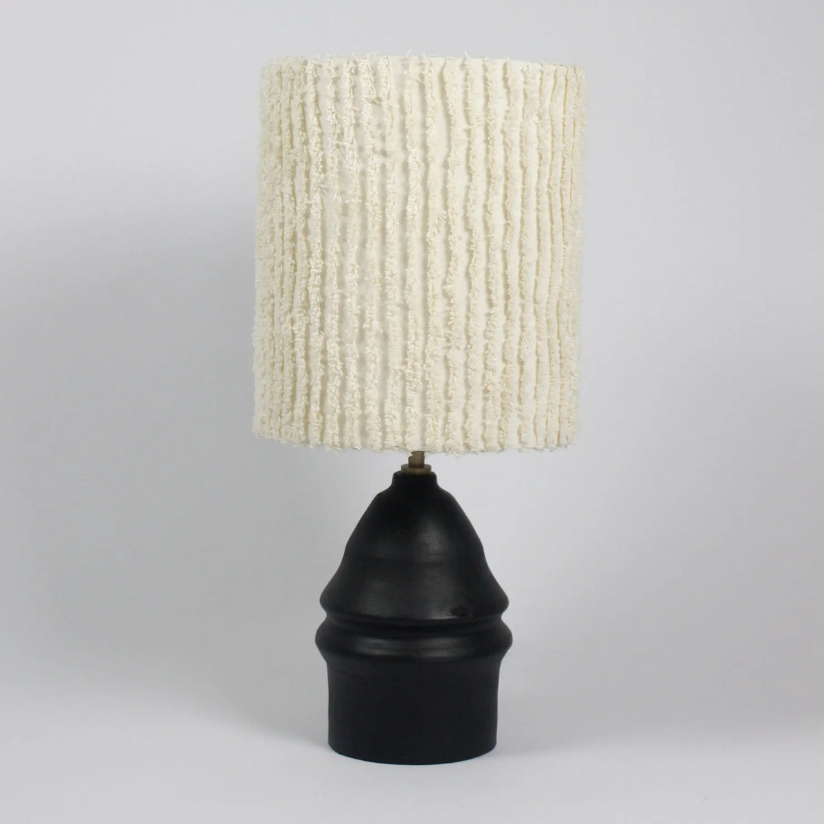 Ella black lamp base by Olsson & Jensen shown with a textured cream shade (shade sold separately)