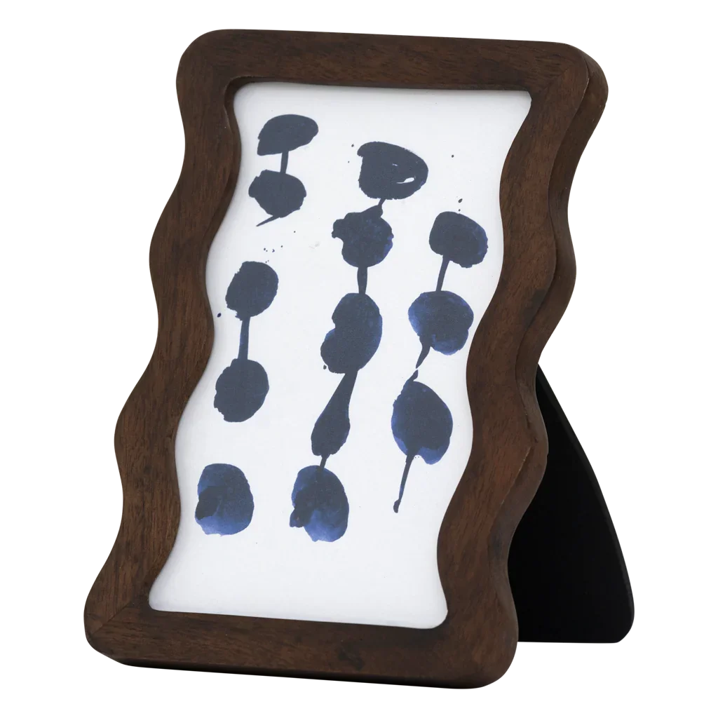 Side view of the Flette wavy mango wood photo frame standing upright