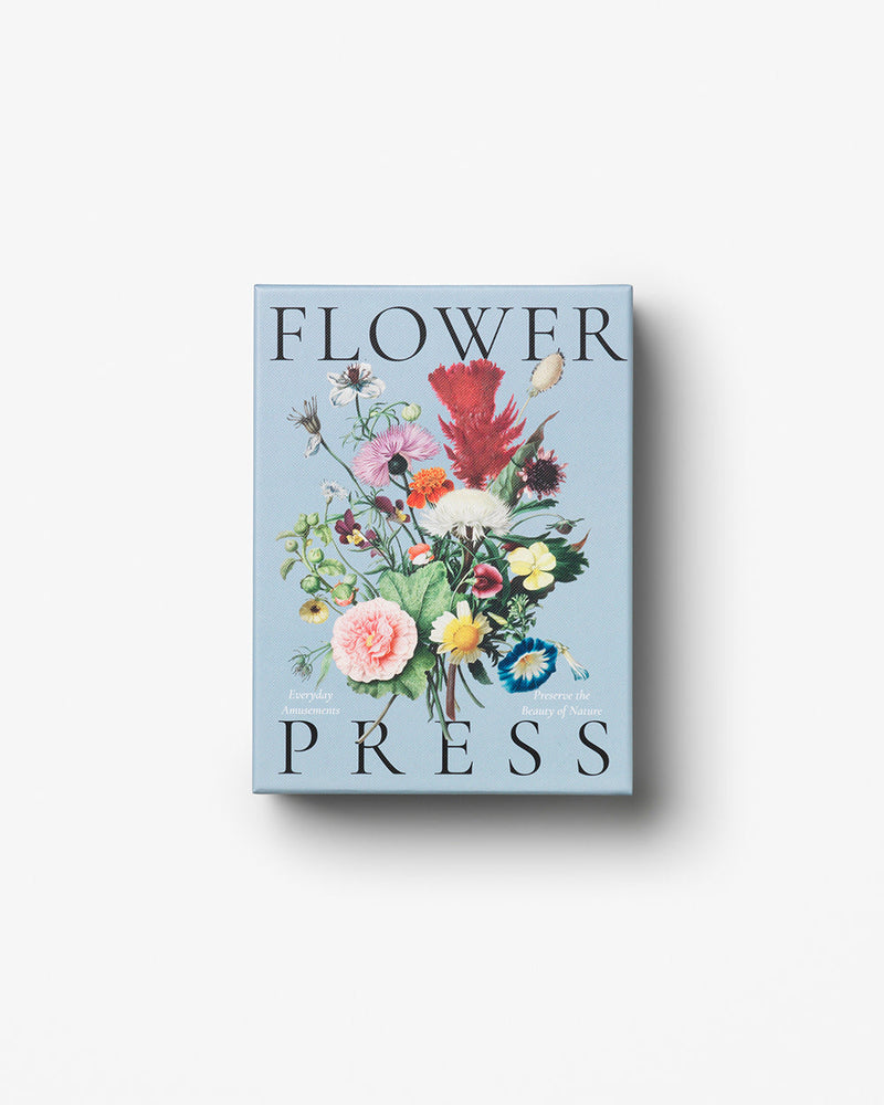 Blue floral box reading ‘Flower Press’ on white background