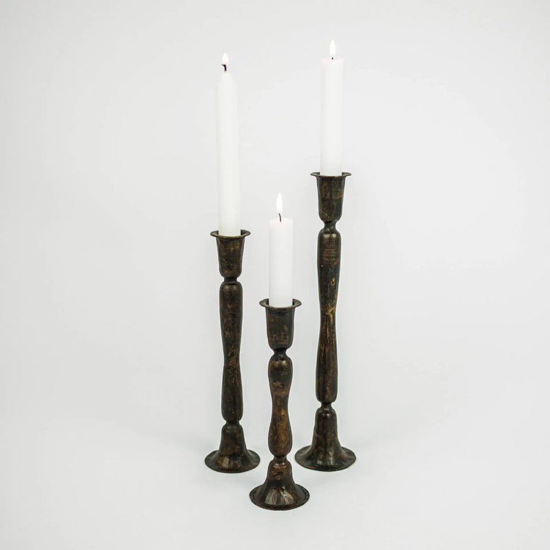 Set of three Gill handmade dark iron taper candlesticks by Olsson & Jensen with white candles