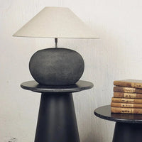 Grace small shade by Olsson & Jensen styled on a lamp on a dark side table