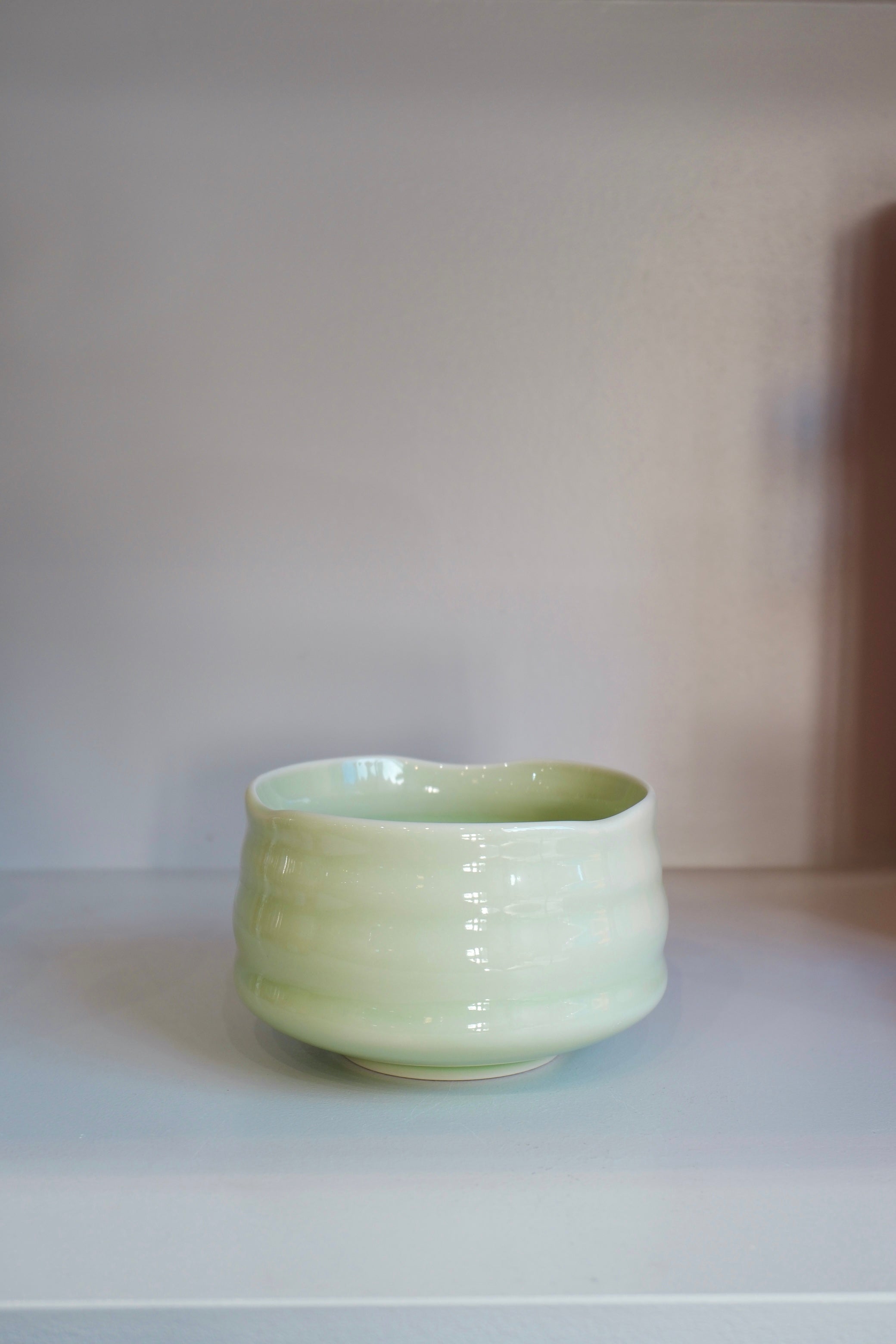 top view of handmade pastel green matcha bowl showing organic rim shape