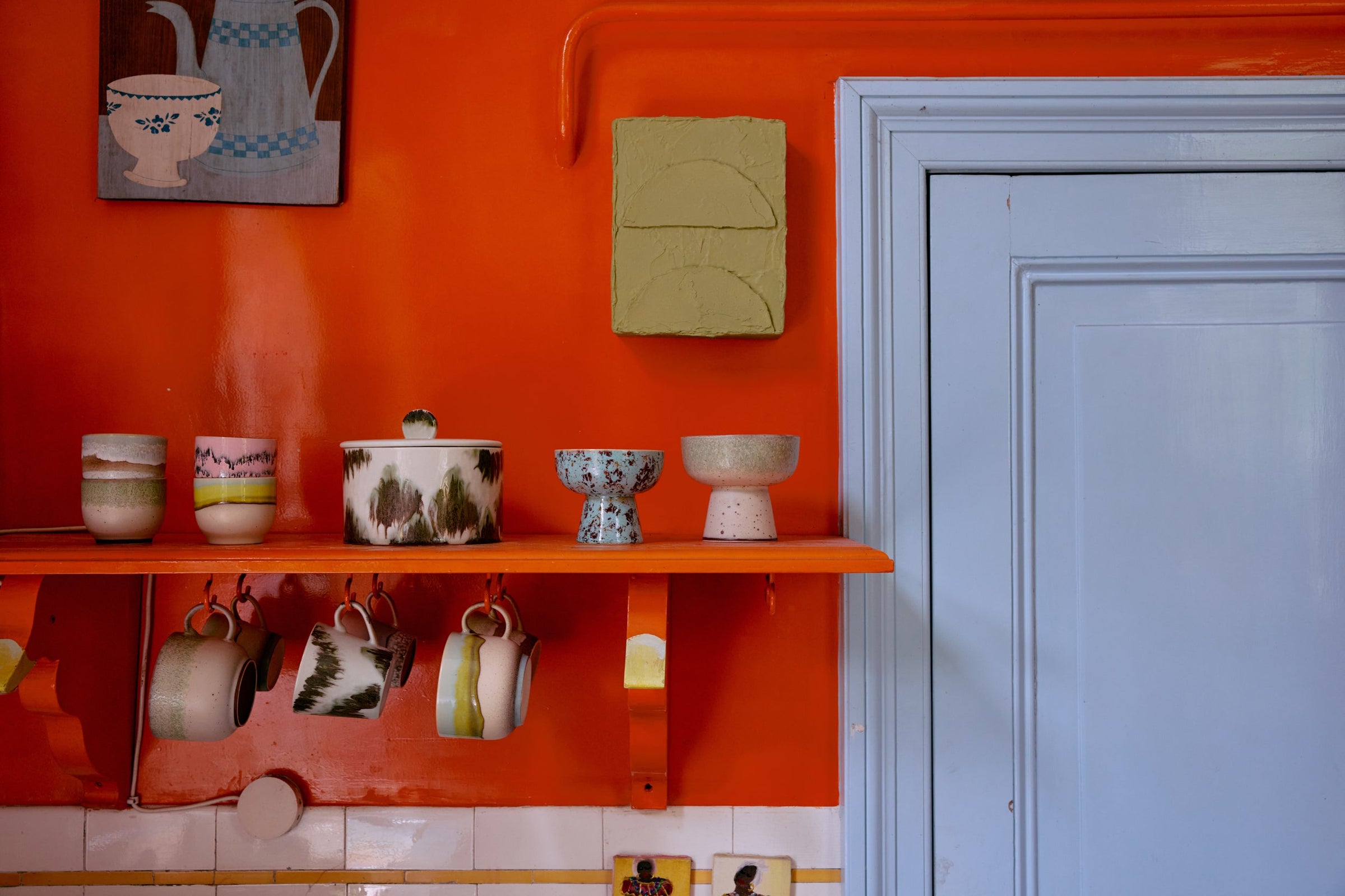 colourful hkliving café cups hanging in a retro-inspired kitchen setting

