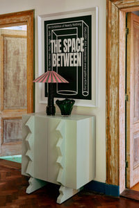 camellia stripe pleated lampshade by HKLIVING styled on a cabinet with bold wall art