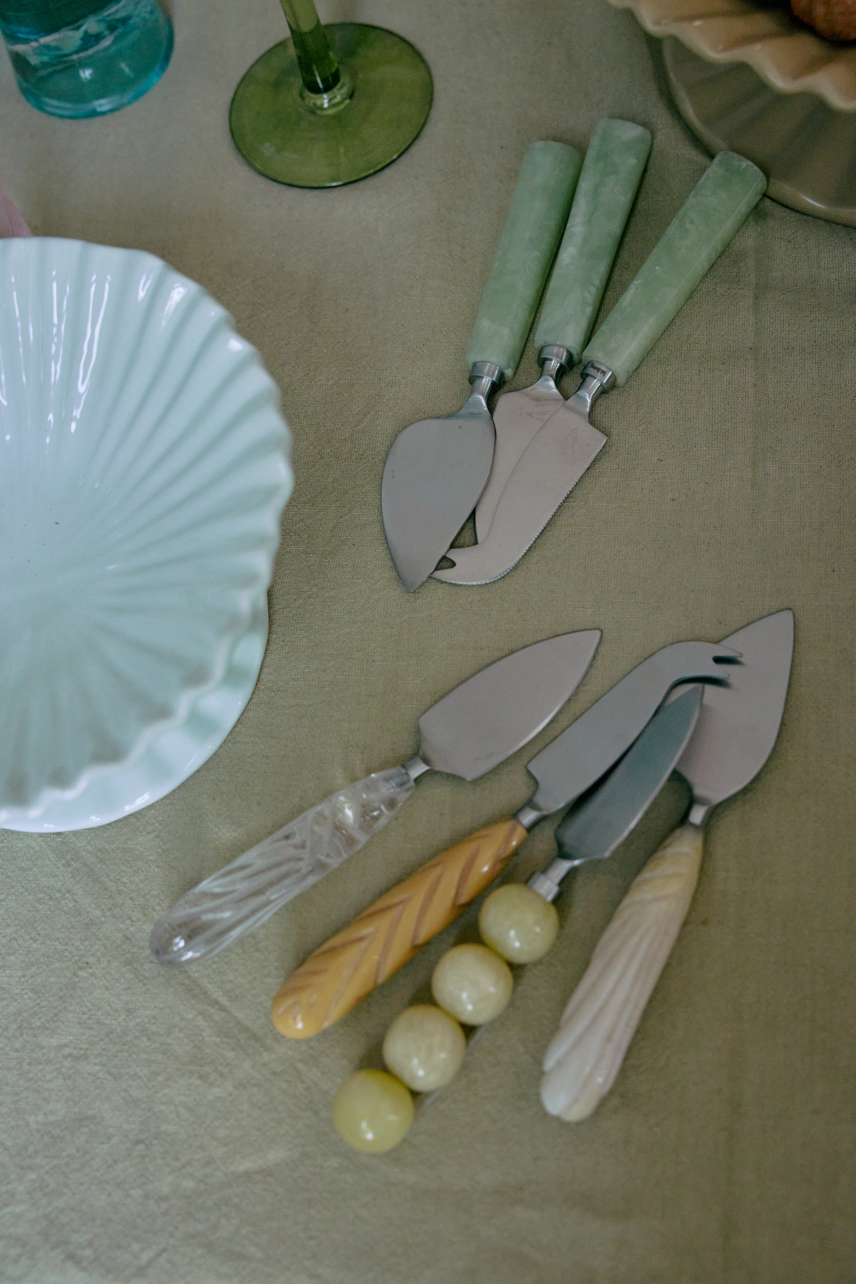 HKLIVING cream, lemon, and sage cheese knives on linen table – modern serveware styling