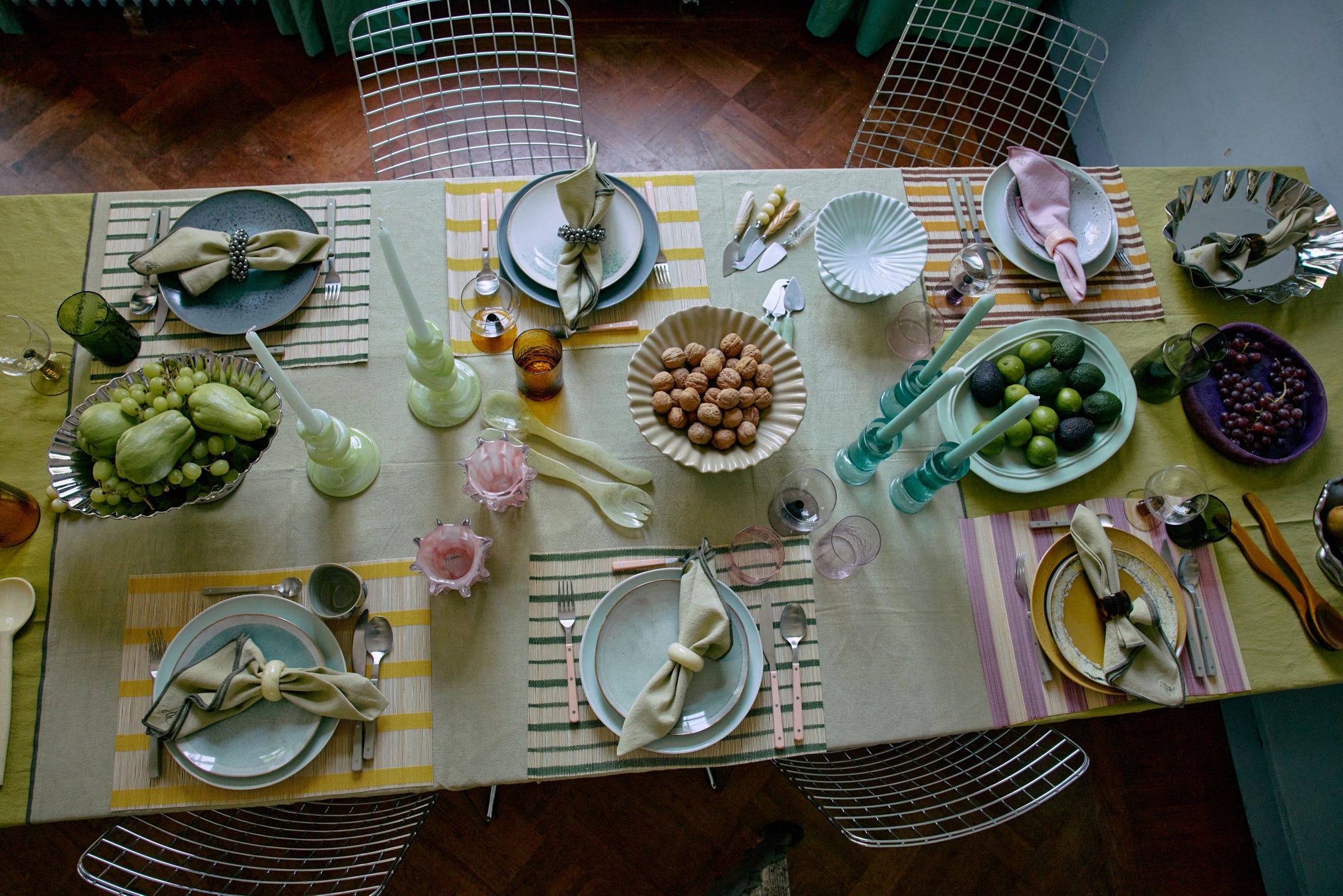 Colourful table setting with HKLIVING lemon cheese knives, green candles, and striped placemats – joyful dining inspiration