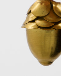 Close-up of the scaled cap and gold finish on a House Doctor acorn decoration