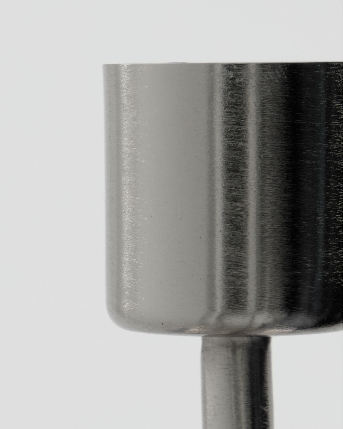 Close-up of the brushed silver finish on the House Doctor Anit candle cup