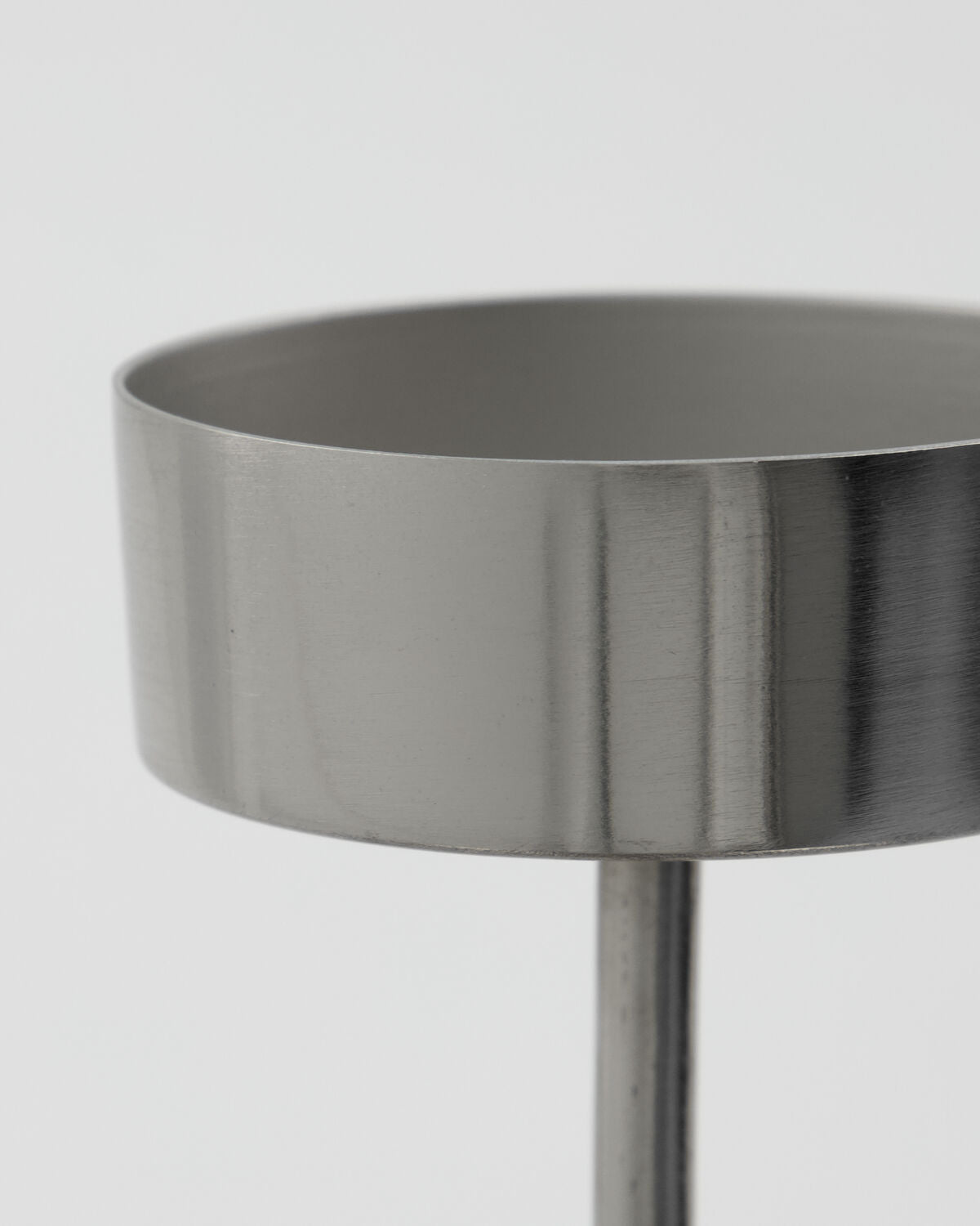 Close-up of the brushed silver tealight cup on the House Doctor Anit tealight holder