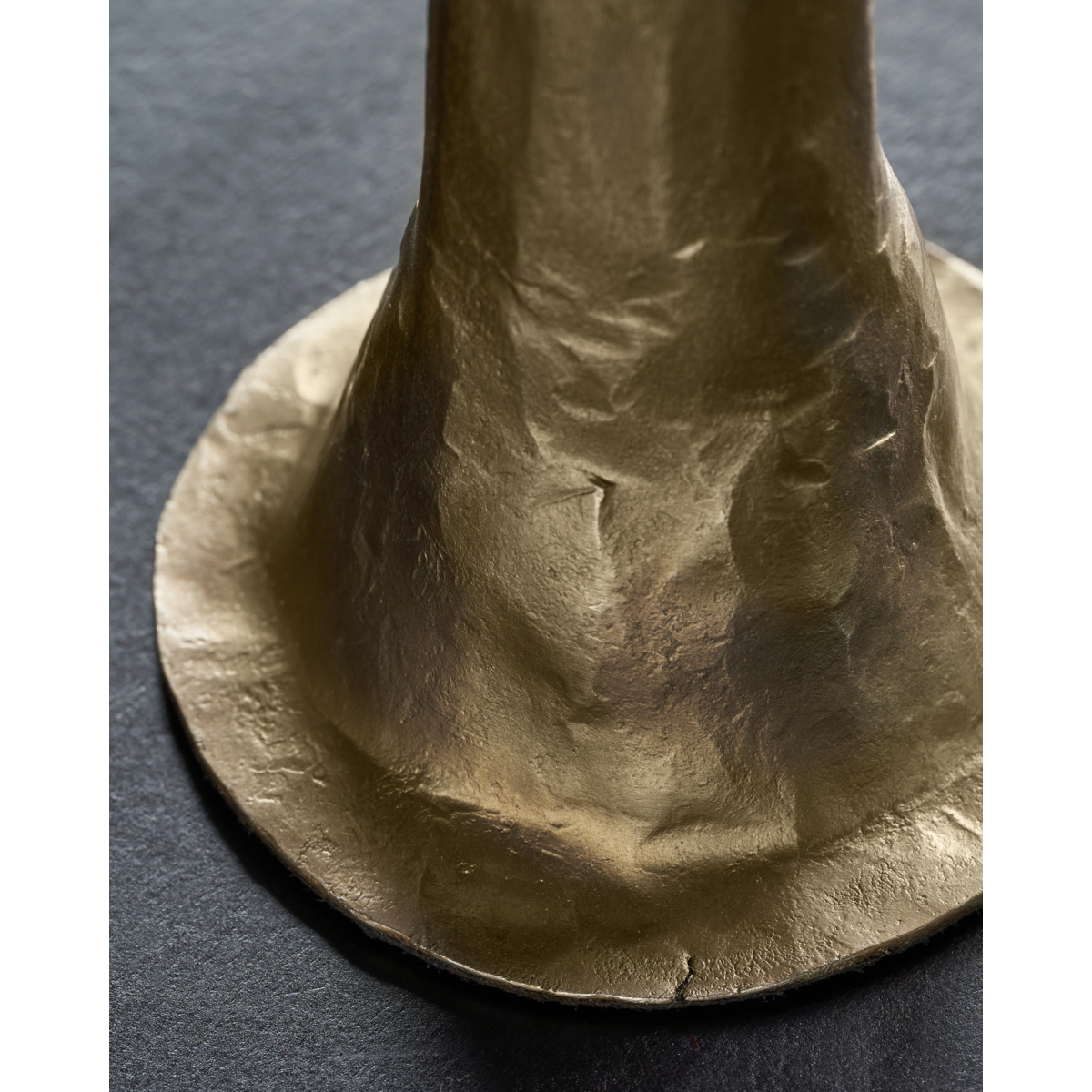 close-up of flared textured base on medium antique gold House Doctor candle holder