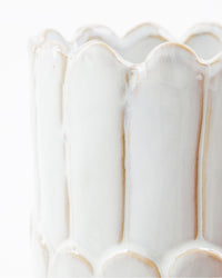 Close-up of the scalloped rim and glossy off-white glaze on the House Doctor Ezra vase
