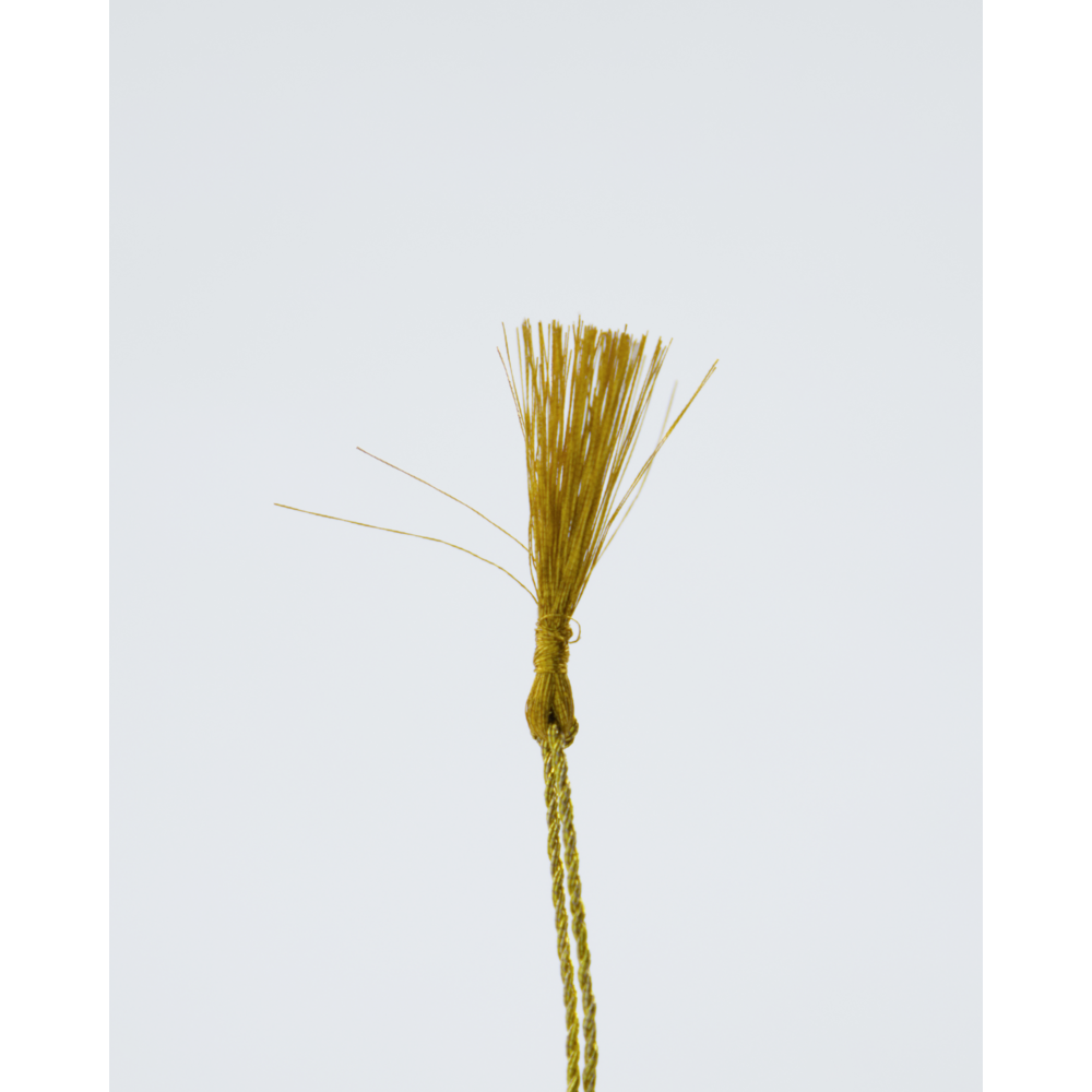 Close-up of gold lurex hanging string used on decorative Easter eggs

