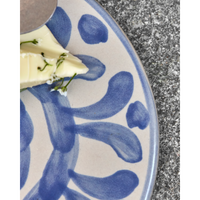 Close-up of brushstroke blue pattern on ceramic surface
