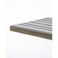Edge detail of hand-painted ceramic board in blue and beige
