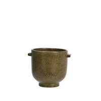 close-up of textured olive stoneware surface and handle detail
