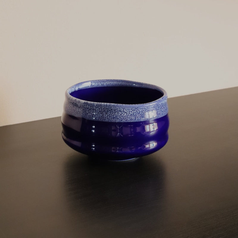 Handmade indigo matcha bowl in deep blue glaze with white crackle rim