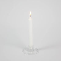 Isabella clear glass taper candle holder by Olsson & Jensen holding a white taper candle