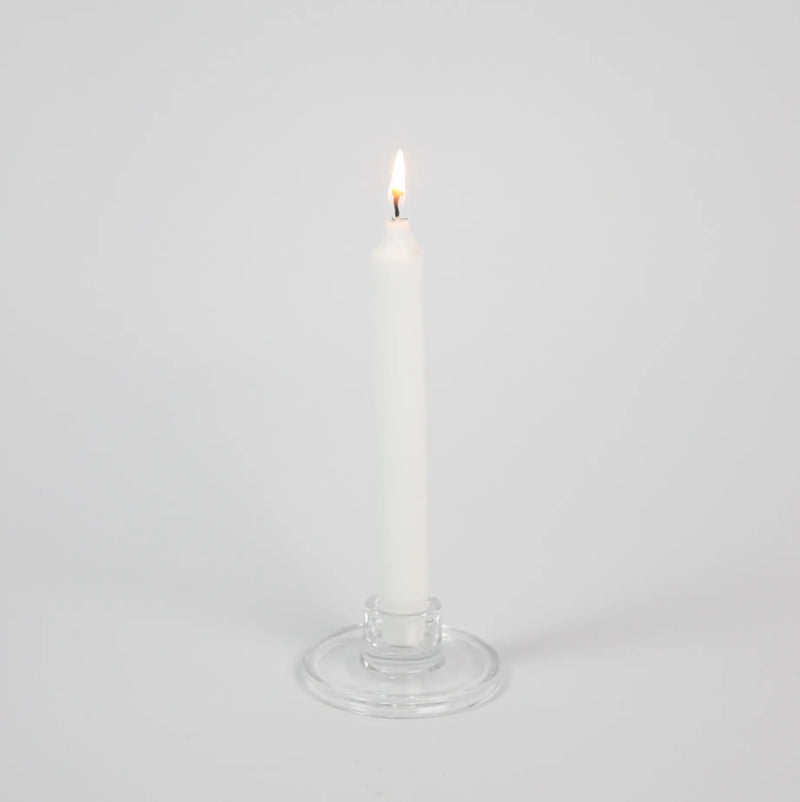 Isabella clear glass taper candle holder by Olsson & Jensen holding a white taper candle