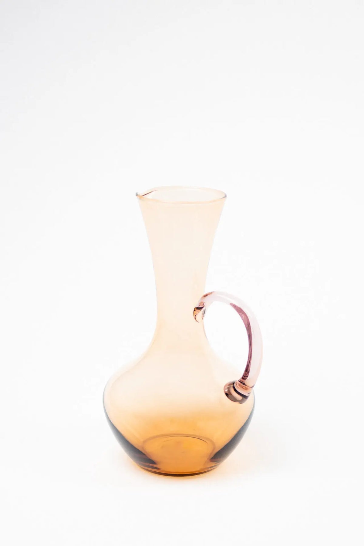 Isidora glass jug by Olsson & Jensen in amber glass with a pink handle, brown pink colourway
