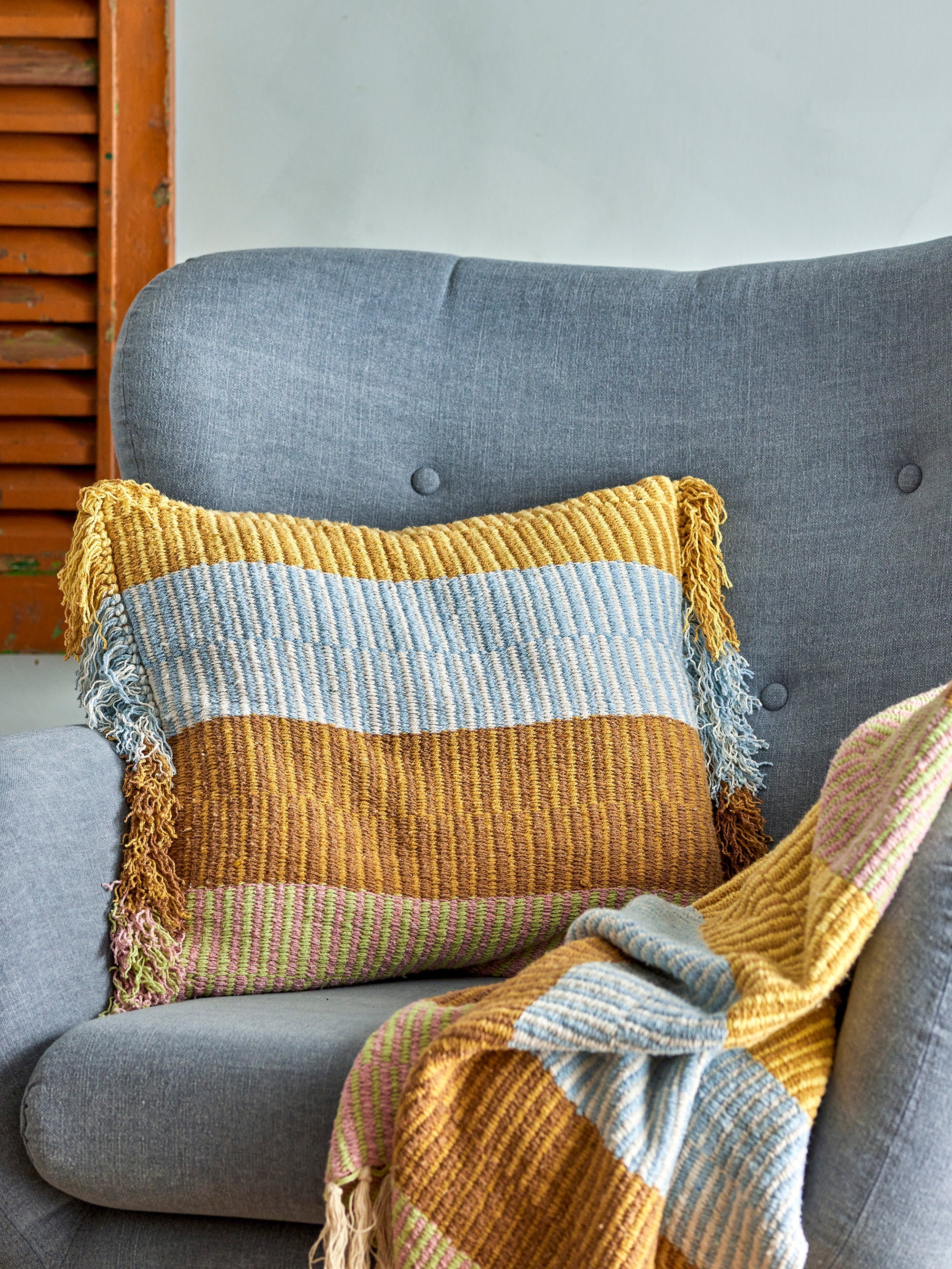 Isnel Throw – Multi by Creative Collection on sofa