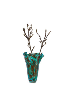 green and blue speckled glass vase with branches showing ruffled rim
