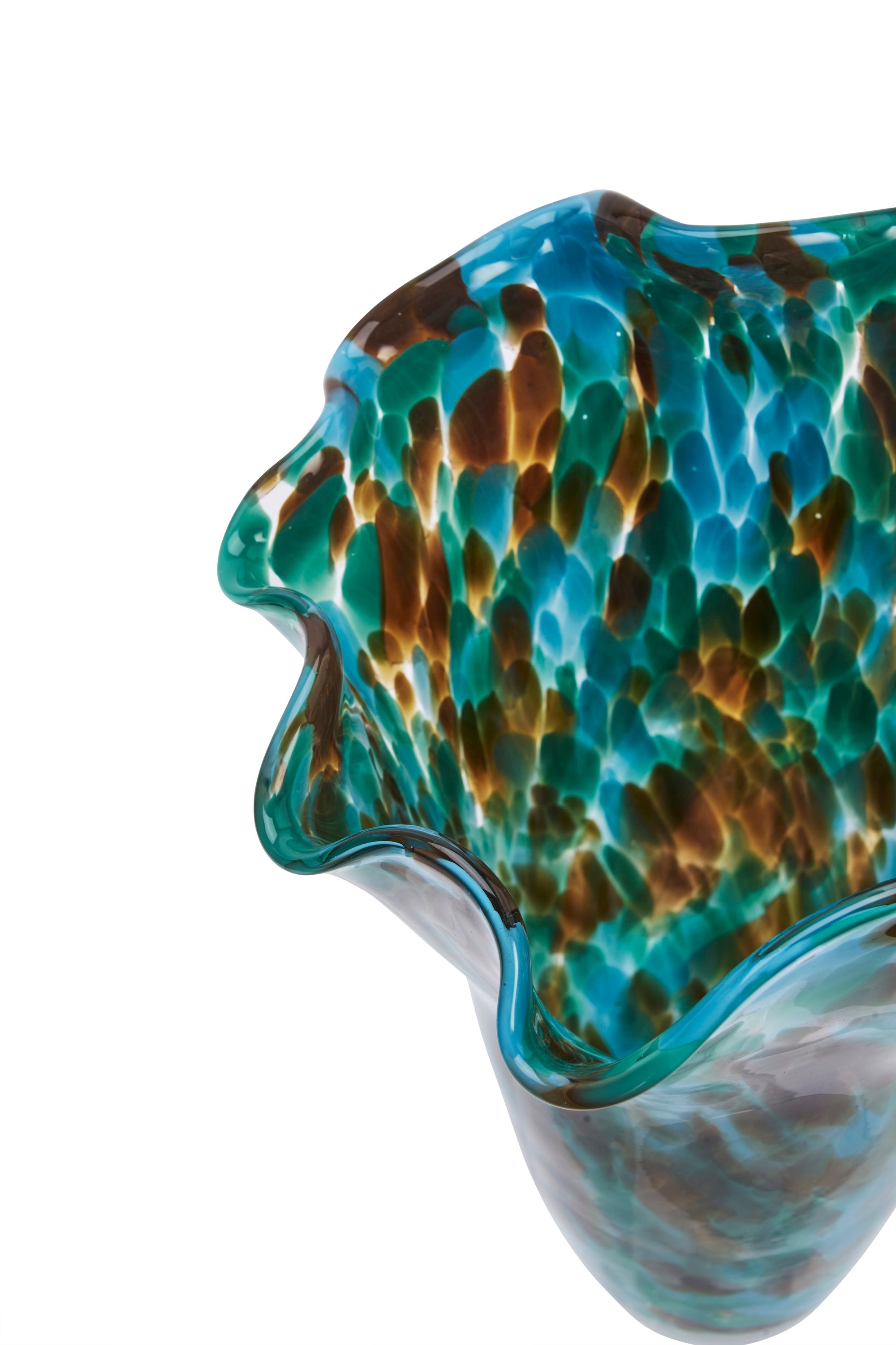 close up of ruffled edge on green blue and brown speckled glass vase
