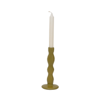 Karn olive green candle holder with an ivory dinner candle