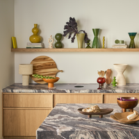 Urban Nature Culture kitchen styling with ceramics on a shelf and marble worktop
