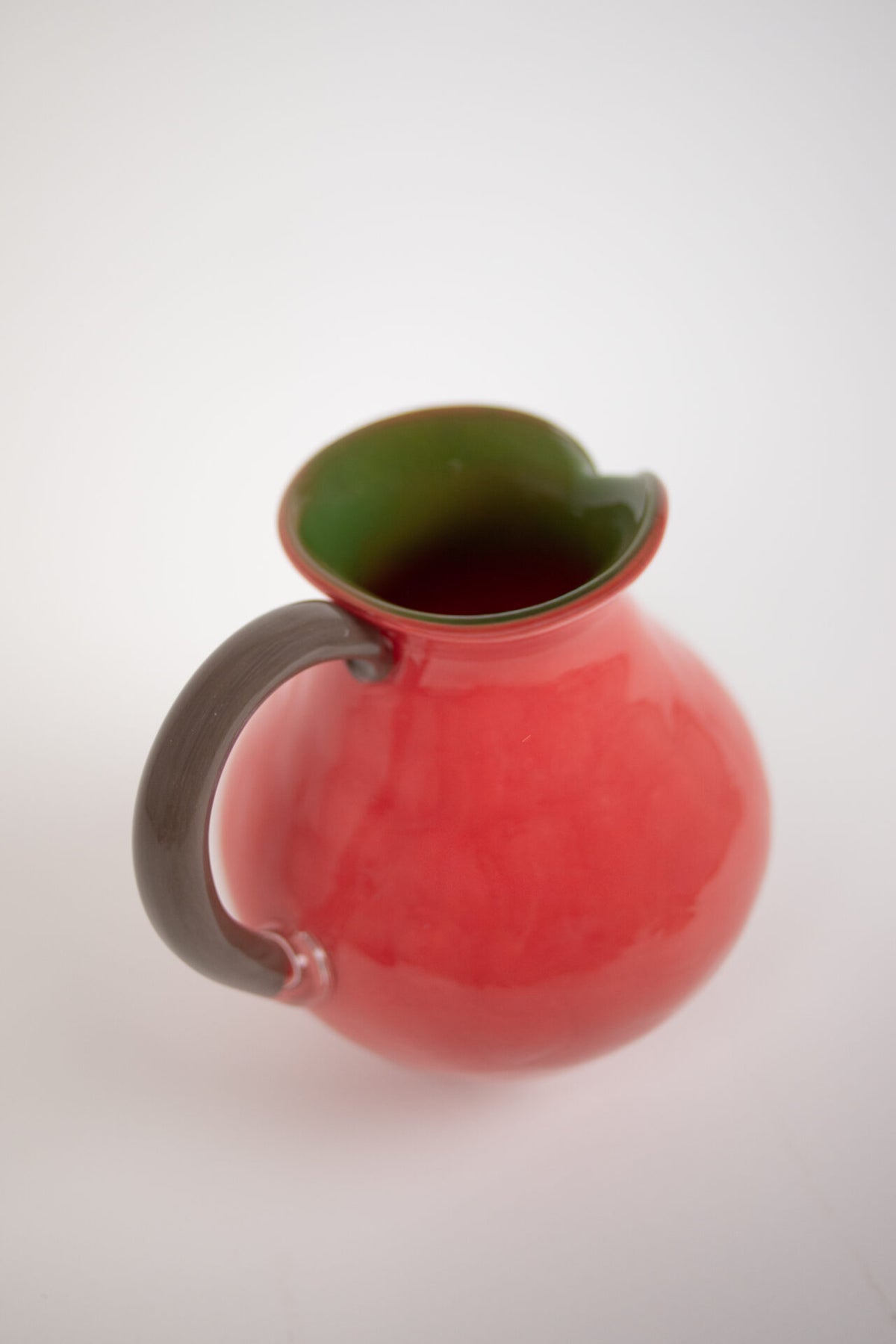 Side view of the Kiko coral jug and handle by Olsson & Jensen