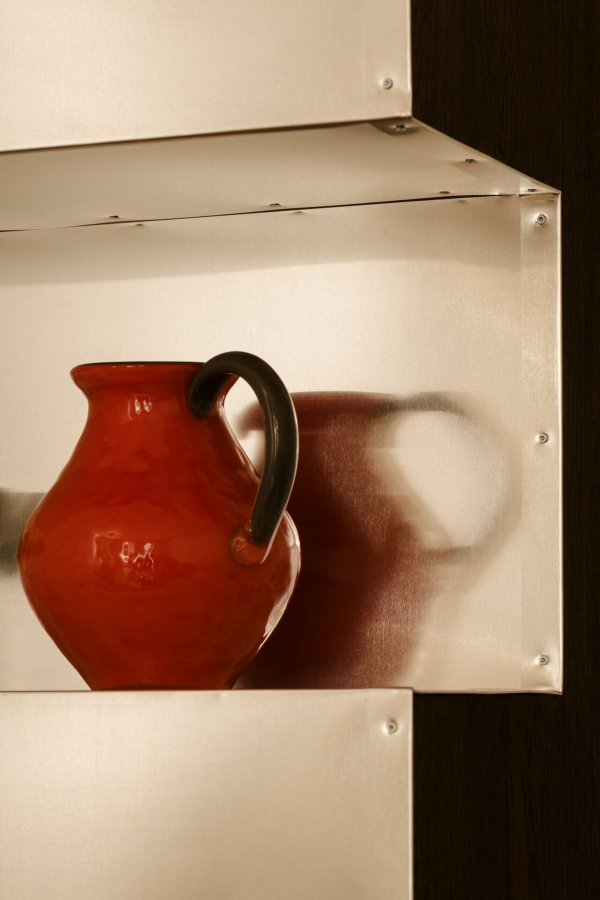 Kiko coral jug by Olsson & Jensen on a mirrored shelf
